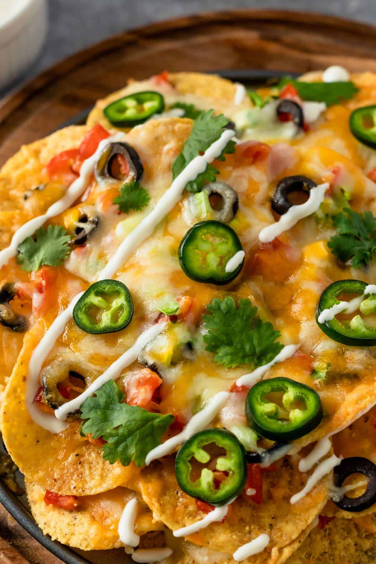 a stack of corn tortilla chips with toppings