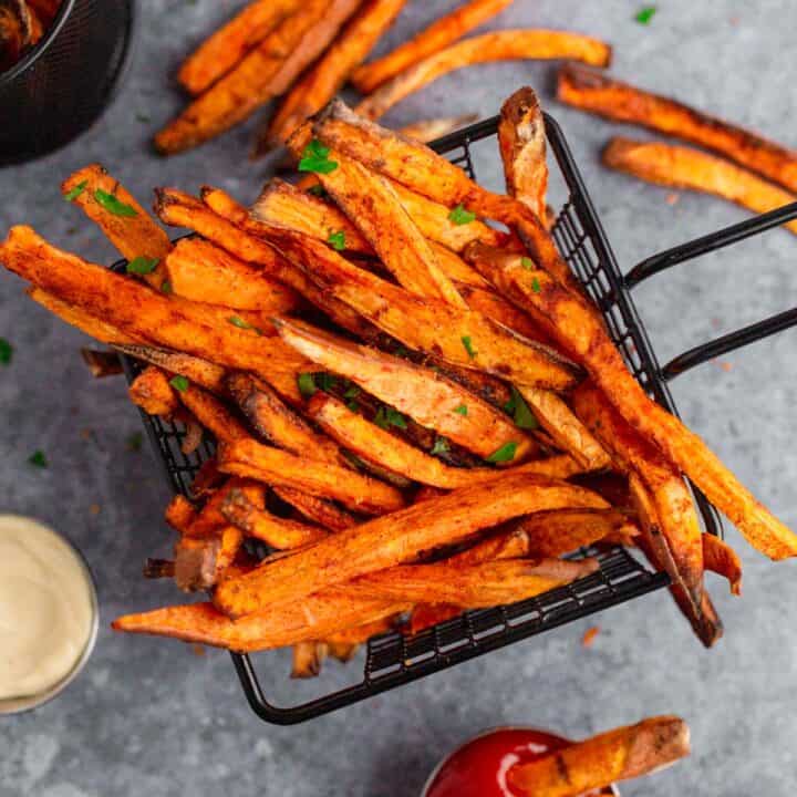 Air Fryer Sweet Potato Fries with parsley and mayonnaise and ketchup