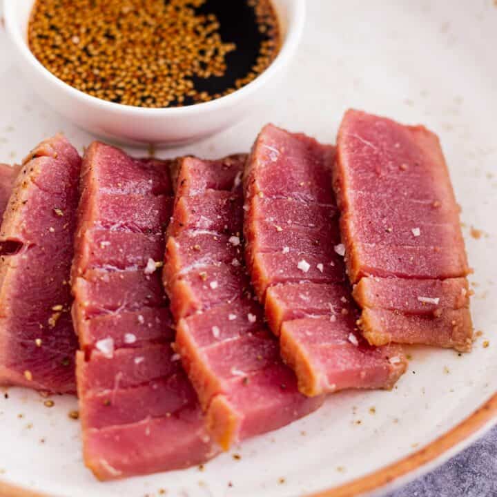 air fryer tuna steak on a bed of cauliflower puree and tomato salsa