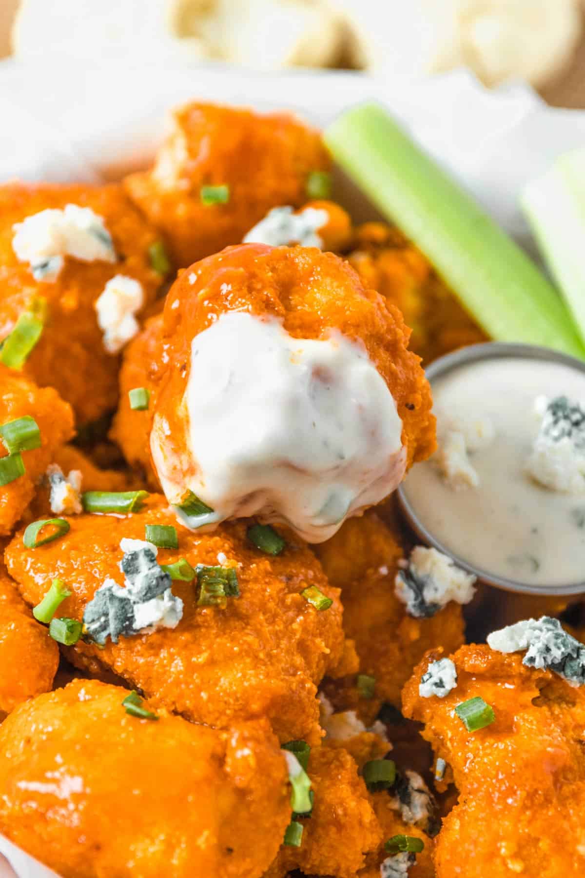 air fryer buffalo cauliflower dipped in white sauce