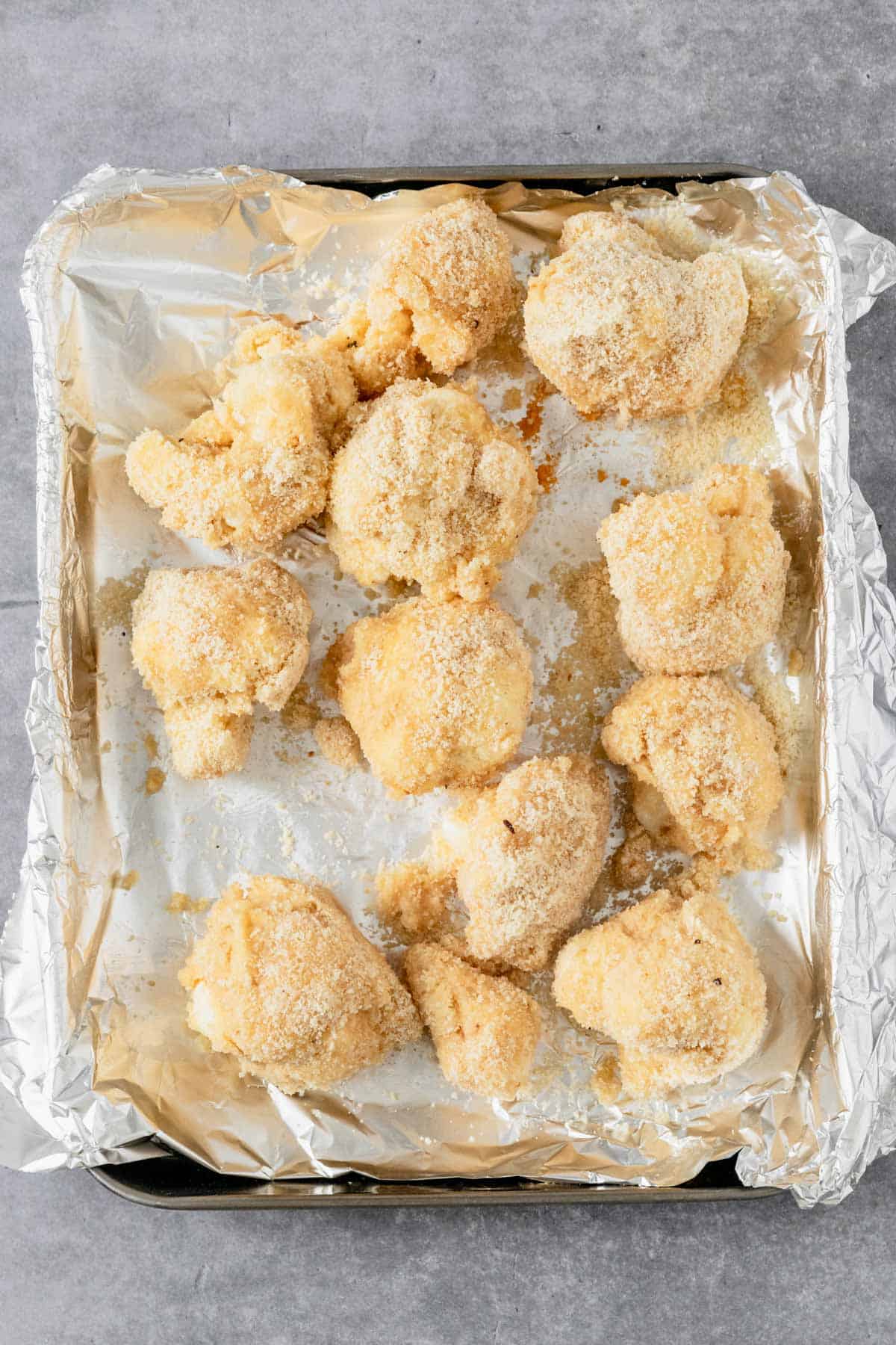 almond flour breaded cauliflower wings on a baking sheet