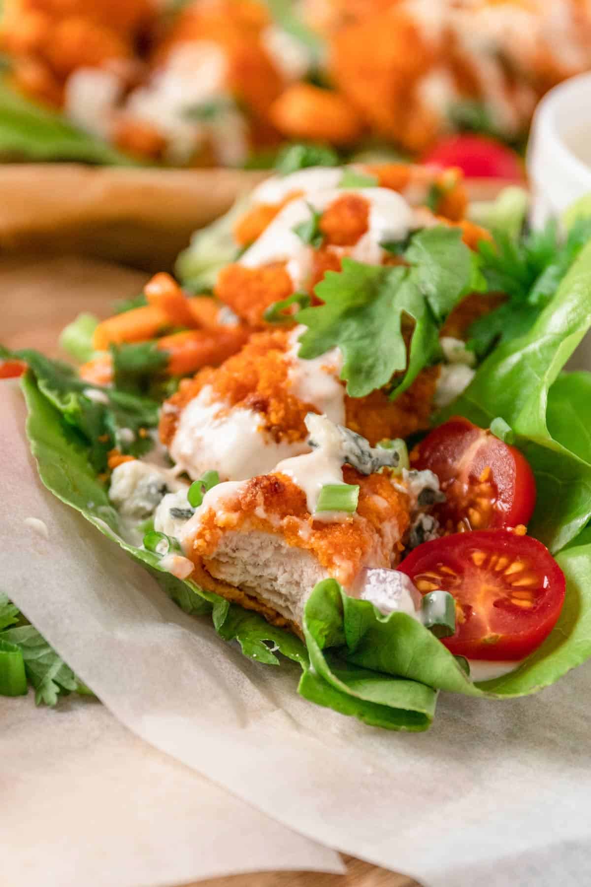 bite shot of Buffalo Chicken Lettuce Wraps