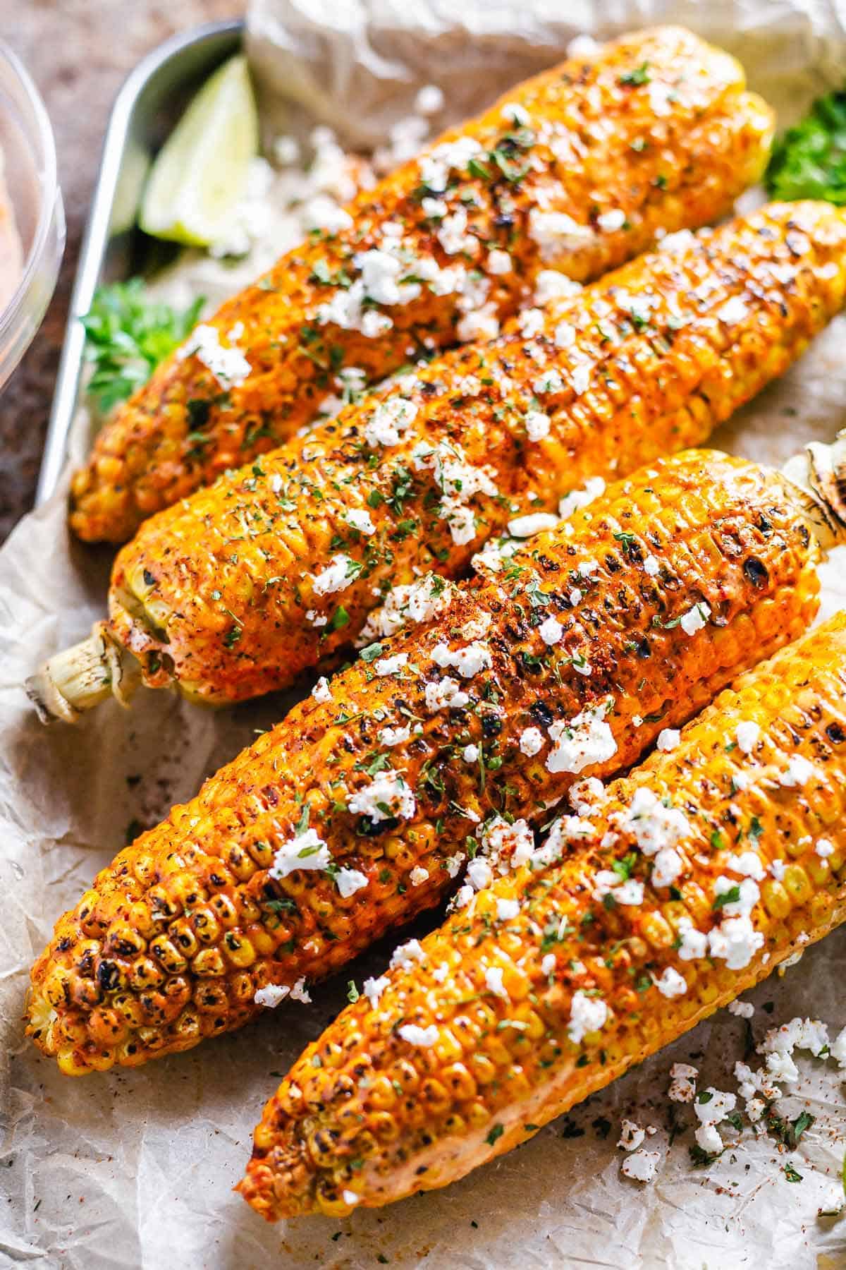 flat lay shot of cajun on the cob on a white plate