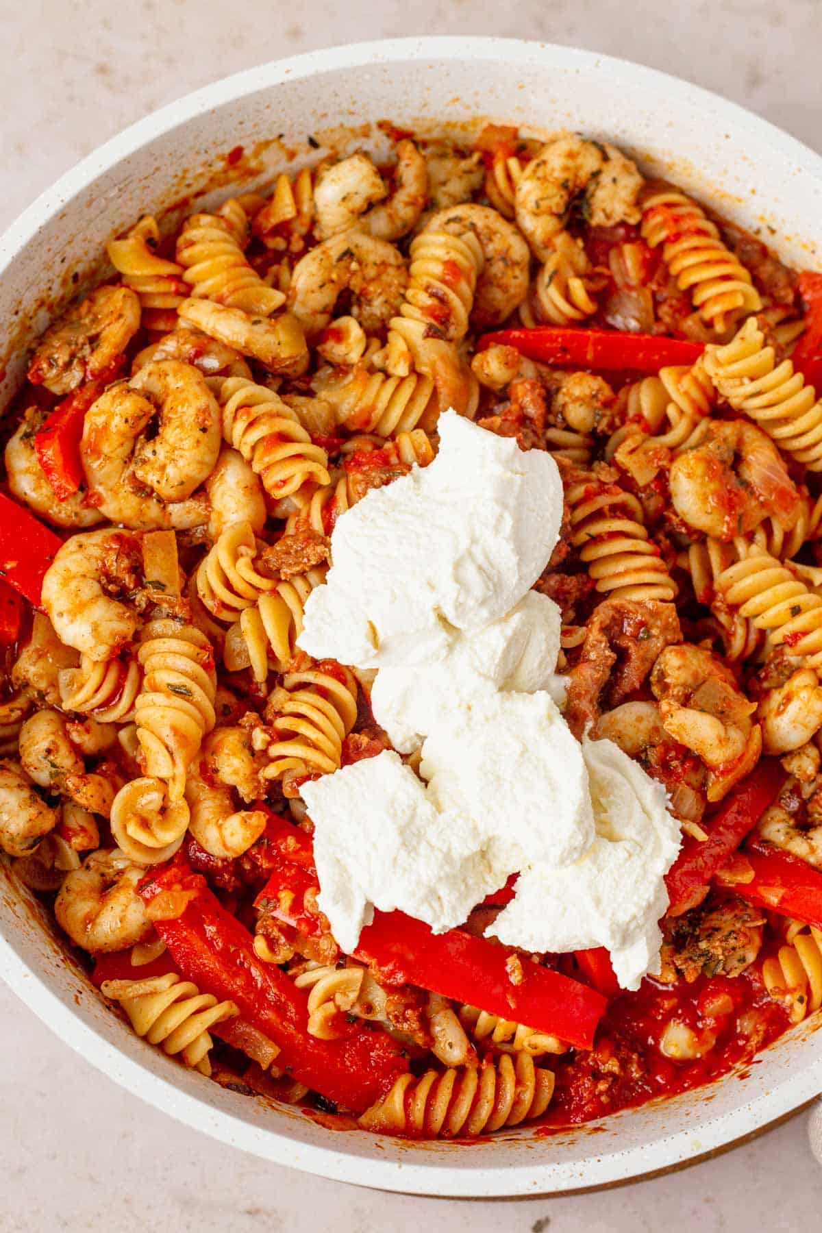 cream cheese added to tomato fusilli pasta