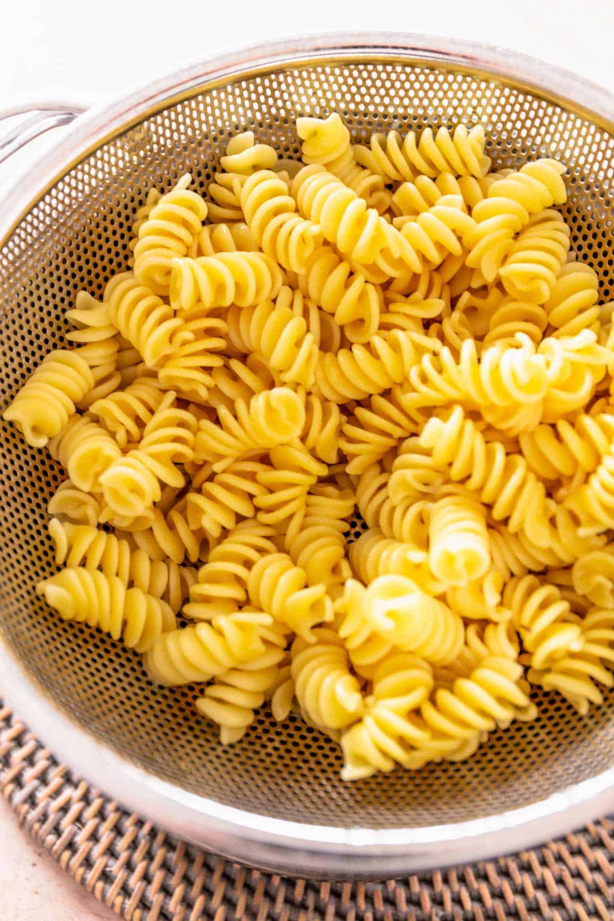 cooked pasta in colander