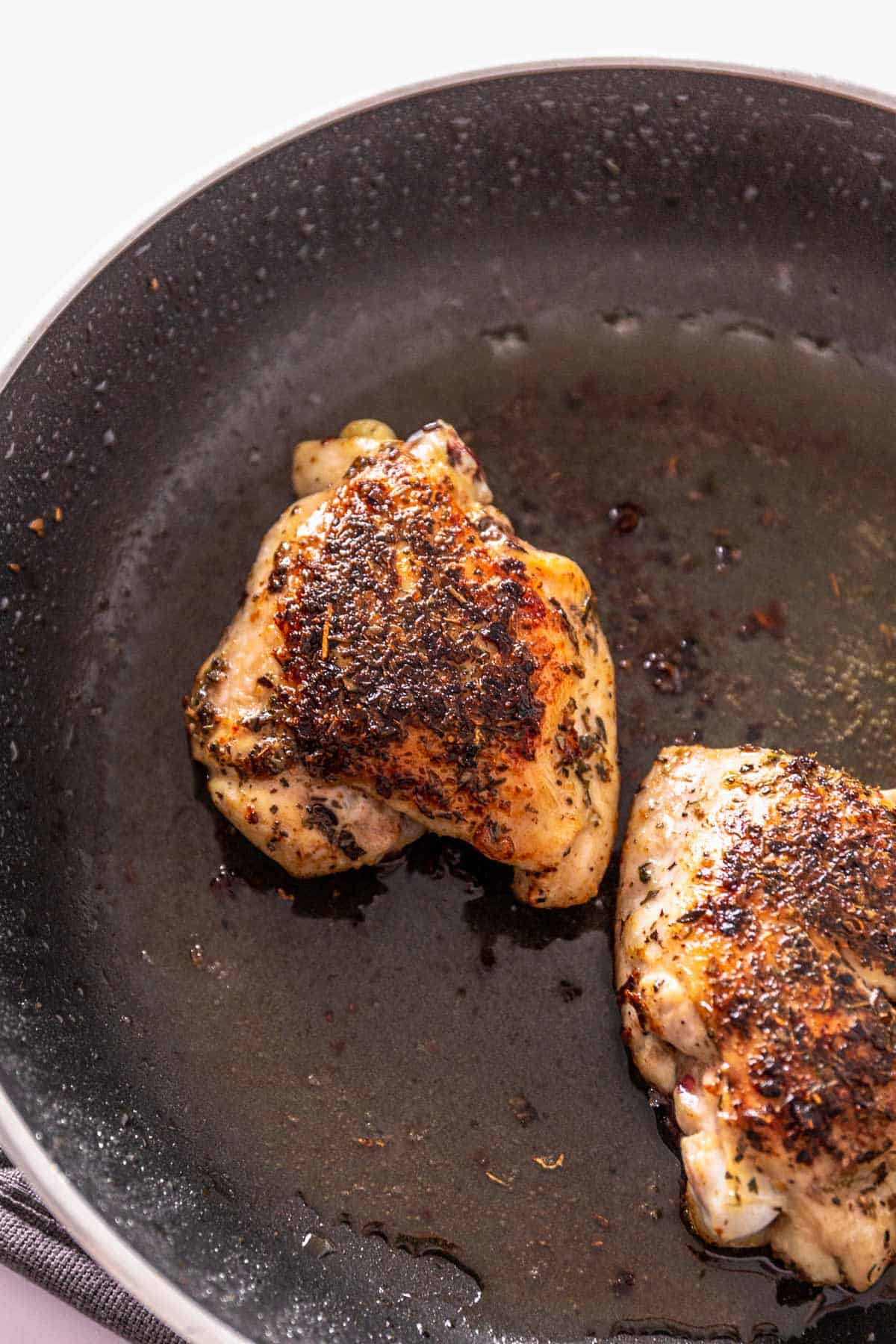 chicken thigs in skillet