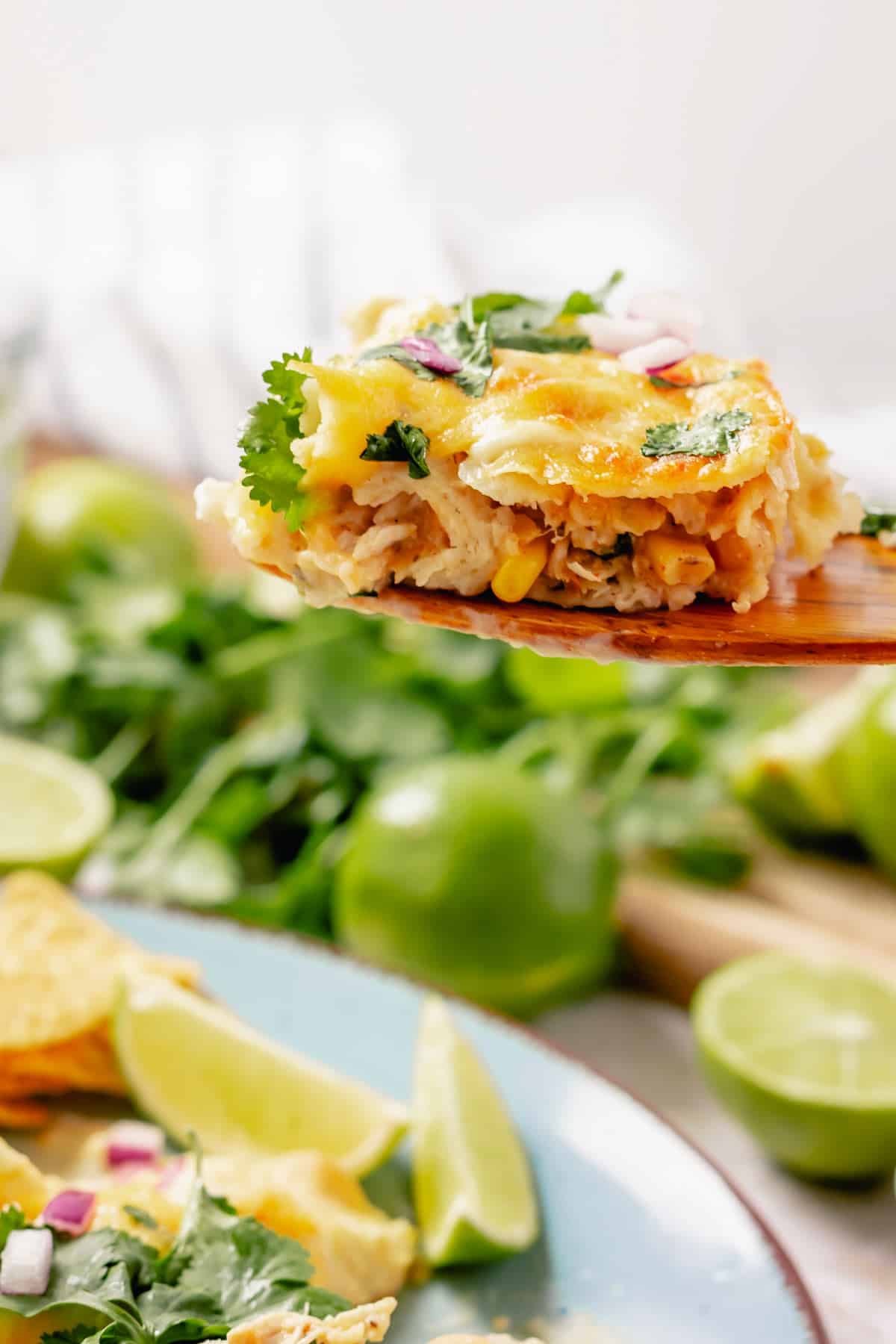 enchiladas on a wooden spatula