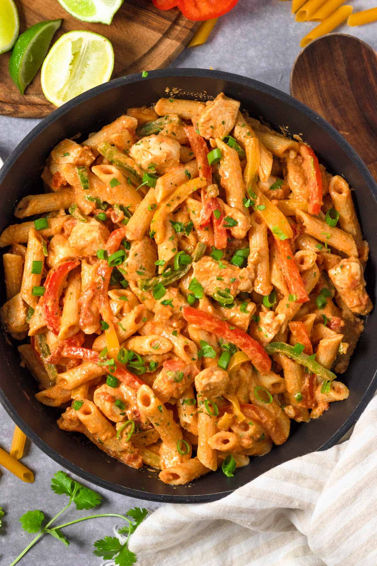 Chicken Fajita Pasta in skillet with herbs