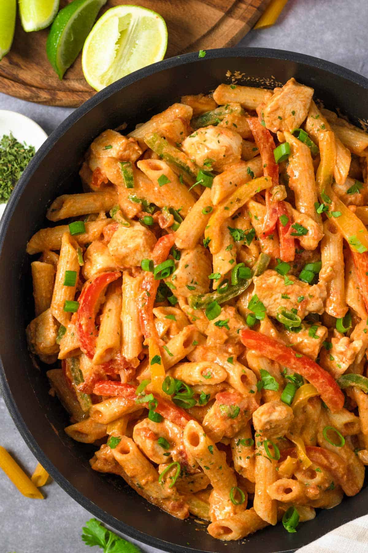 Chicken Fajita Pasta in skillet with herbs