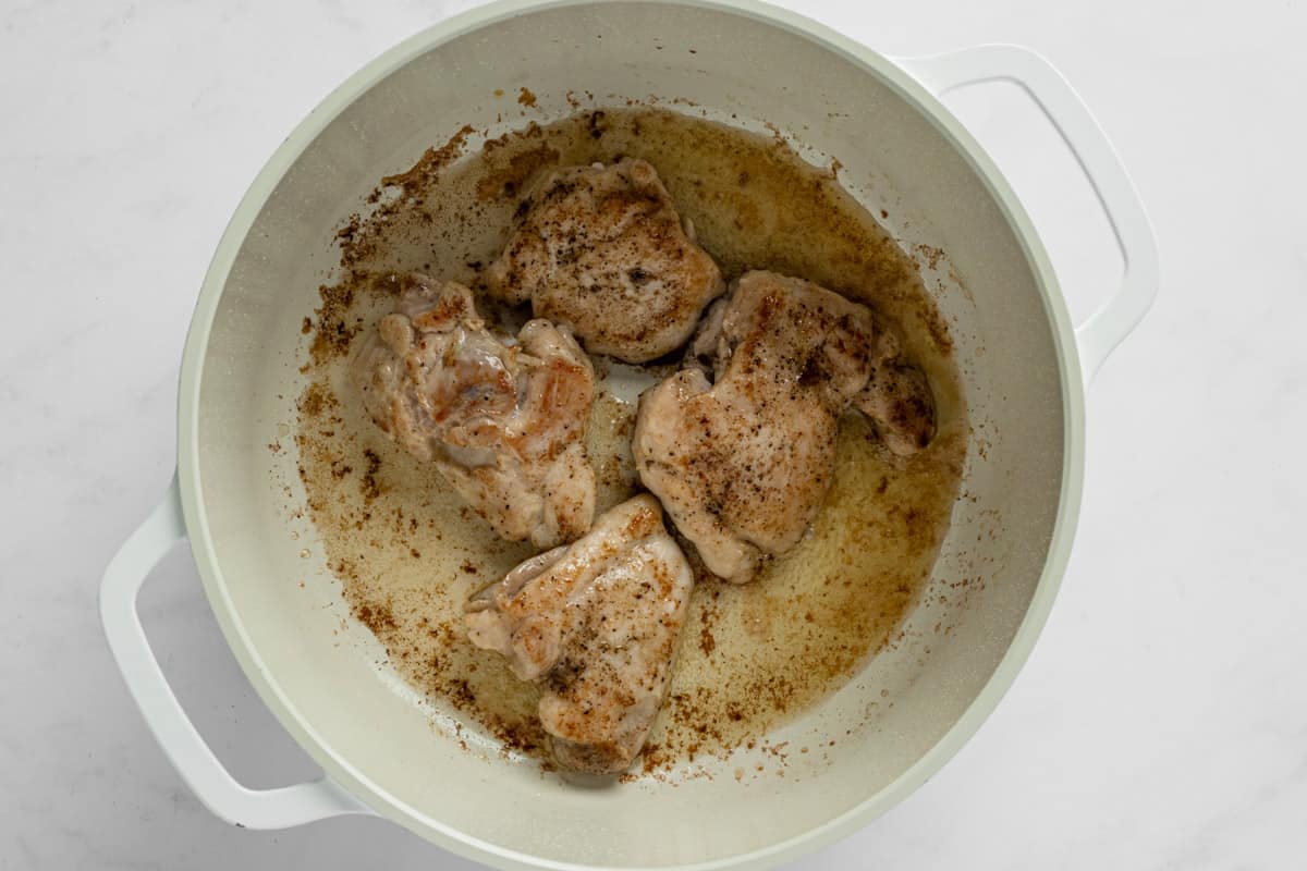 searing chicken in a pot