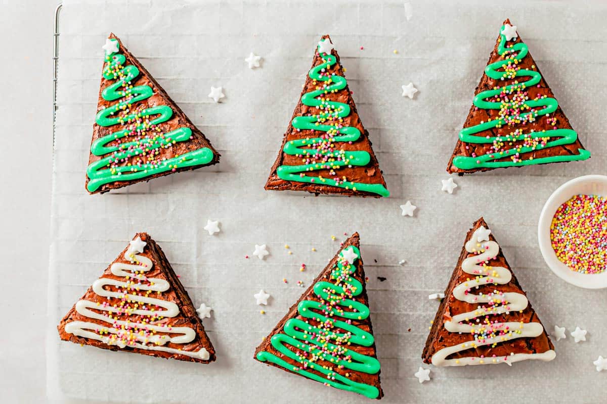 christmas tree brownies with green powdered sugar glaze and sprinkles