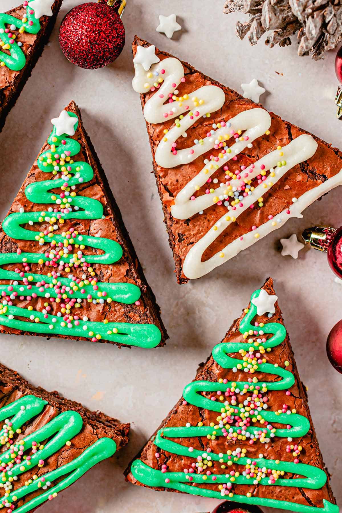 christmas tree brownies with green powdered sugar glaze and sprinkles