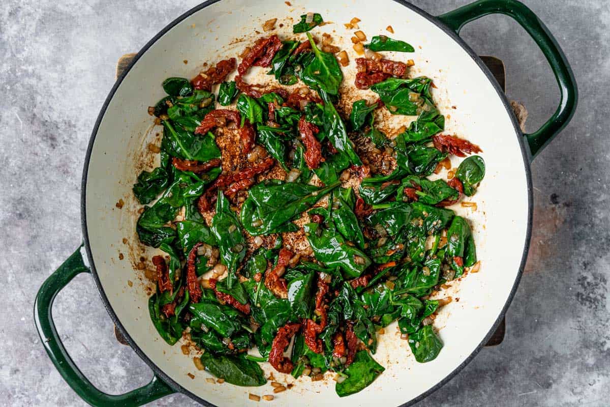 Chicken breasts in an irresistible creamy sun dried tomato sauce filled with spinach, delicious smoked paprika, parmesan, and topped up with salty crispy bacon is definitely a winner of a chicken dinner! - The Yummy Bowl