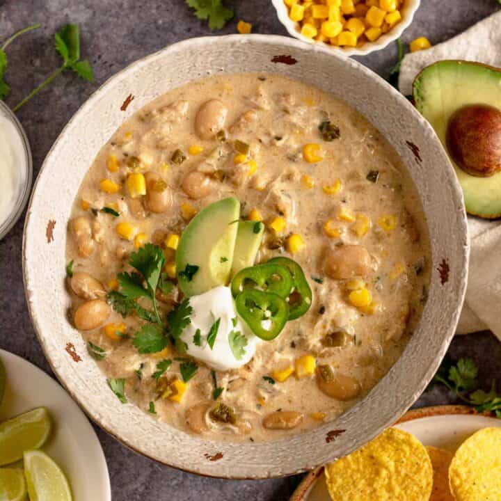 Crock Pot Chicken Chili Cream Cheese with doritos and cilantro, avocado