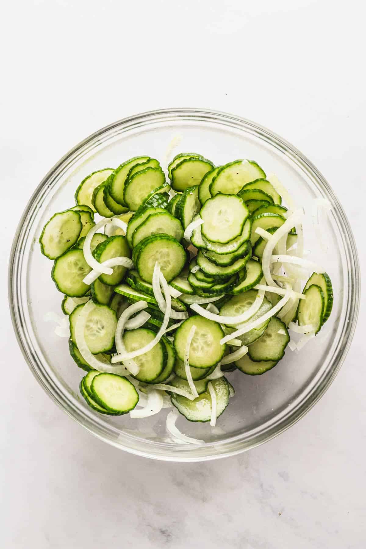 A bowl of Cucumbers and Onions In Vinegar 