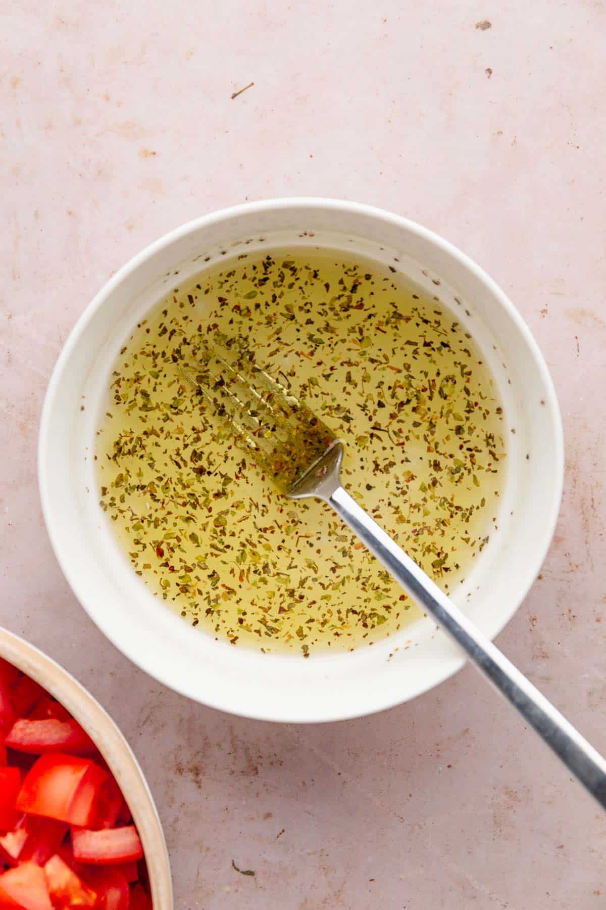 a bowl of vinegar dressing for cucumber salad.