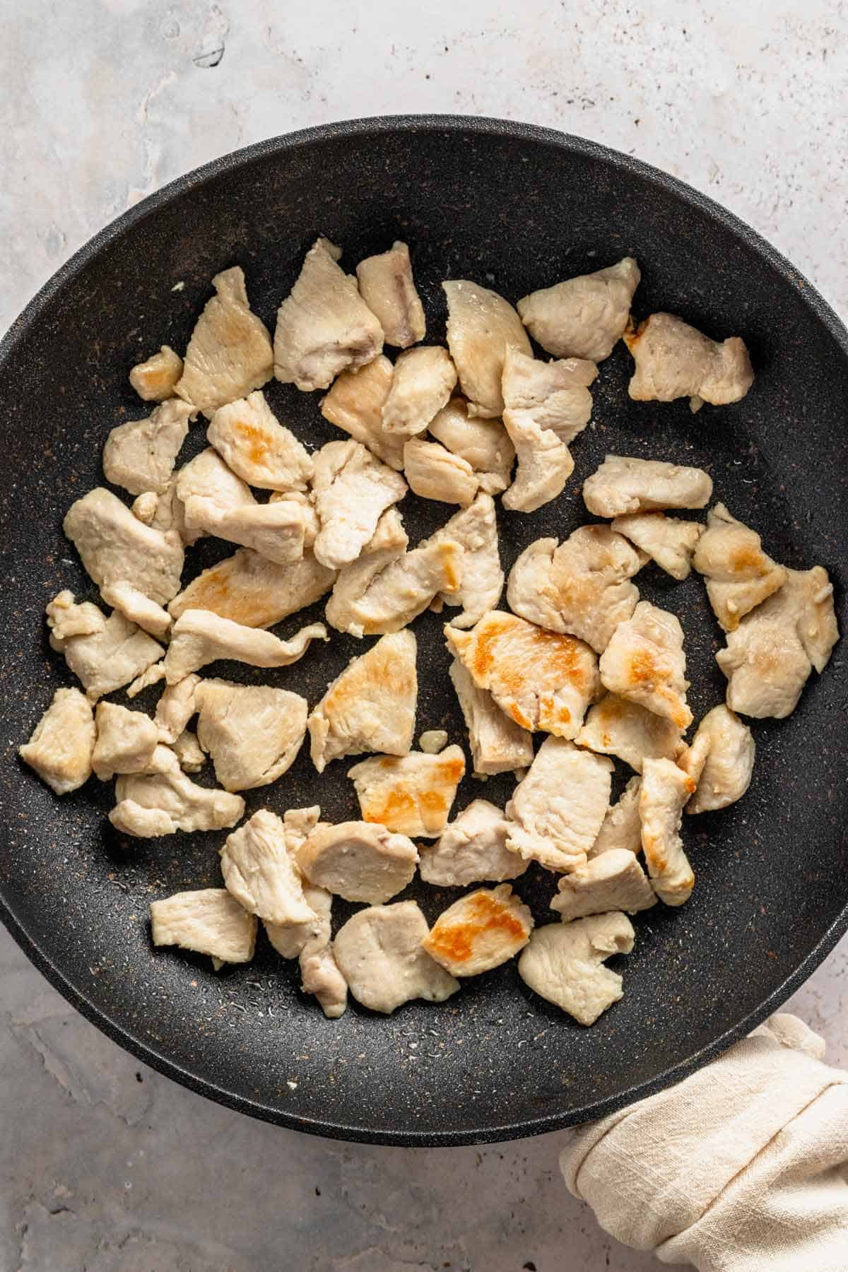 chicken bits in skillet.