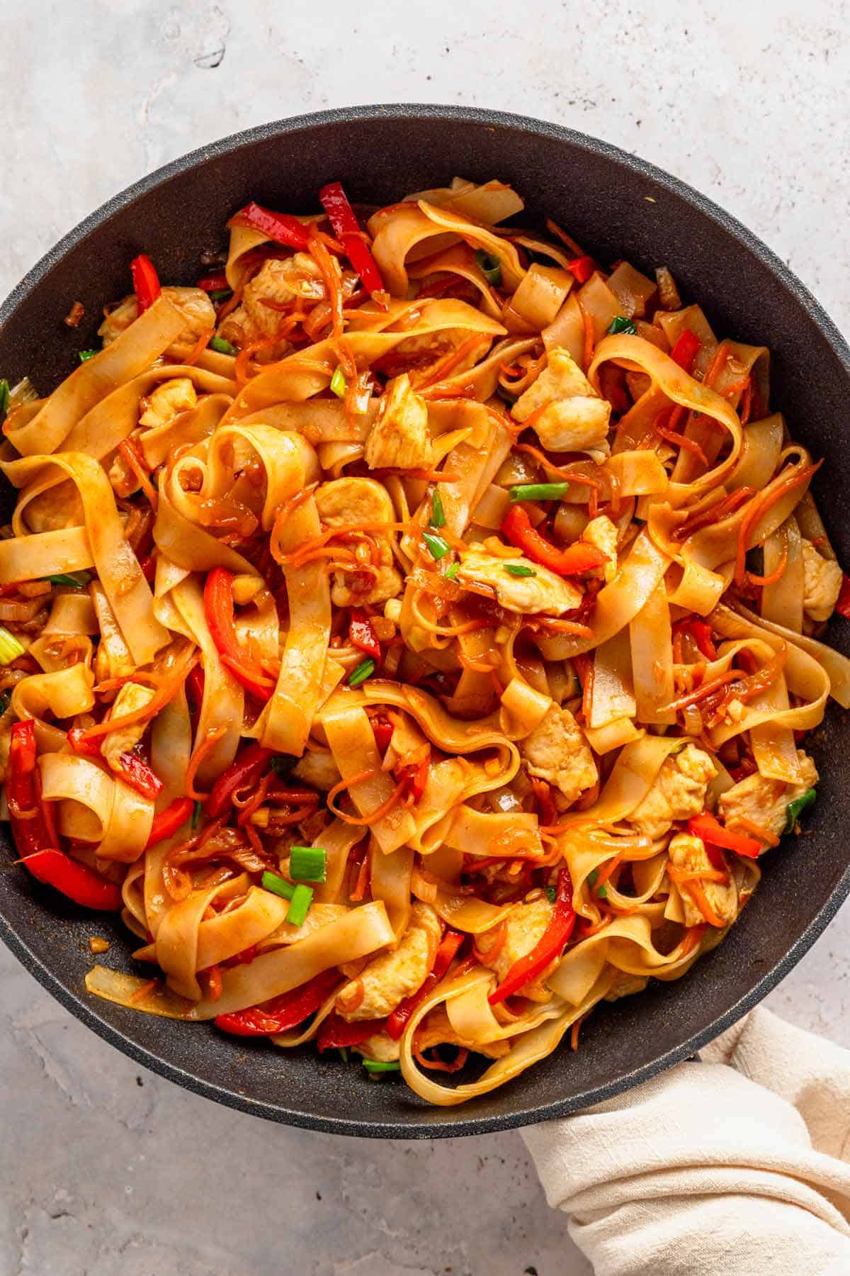 wide rice noodle vegetable stir fry.