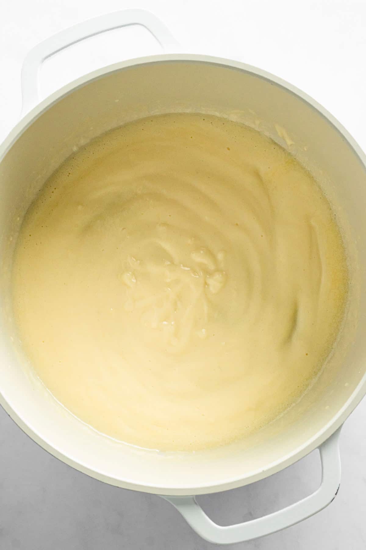 creamy mixture sauce for corn casserole in a pot.