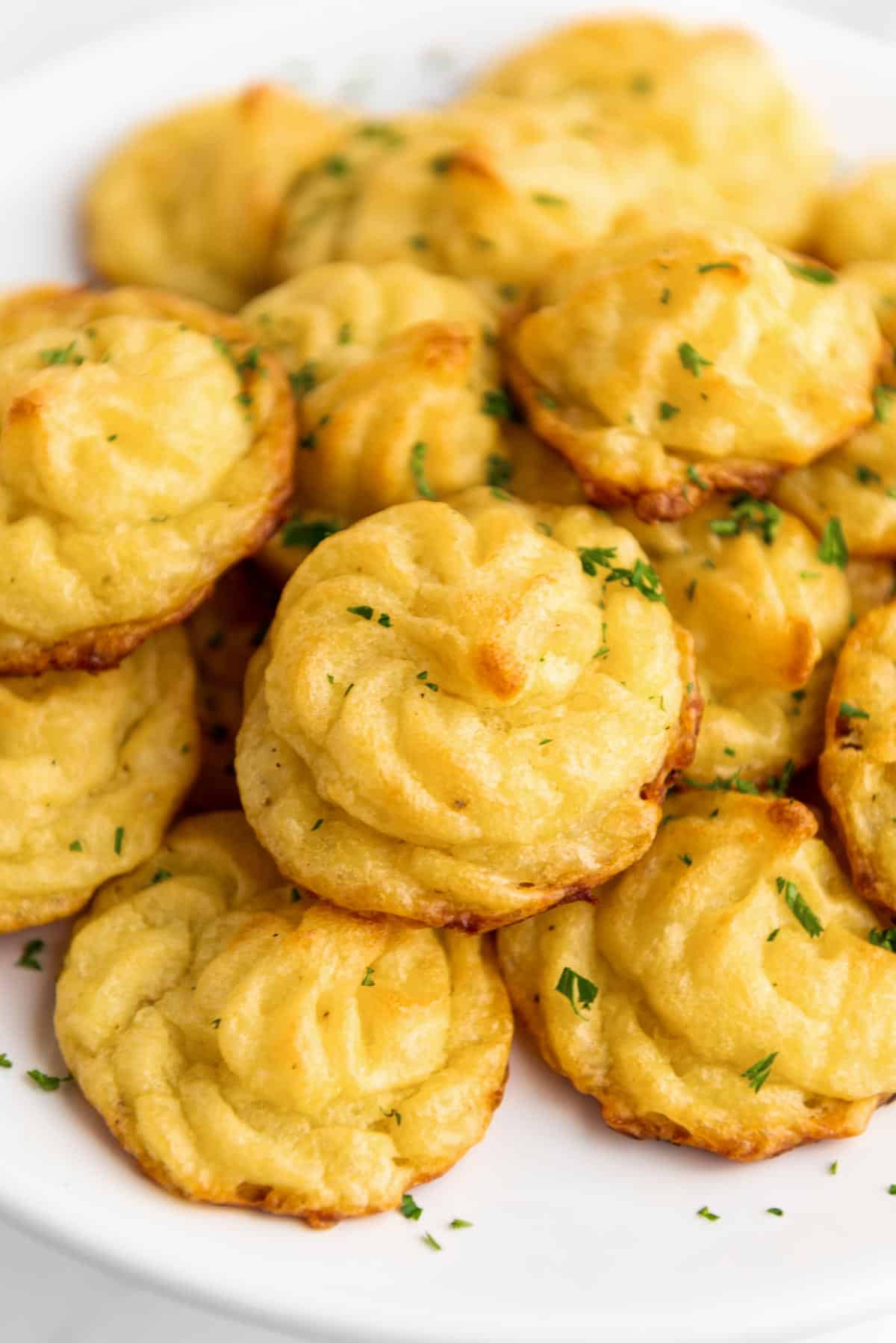 a stack of duchess potatoes on a plate