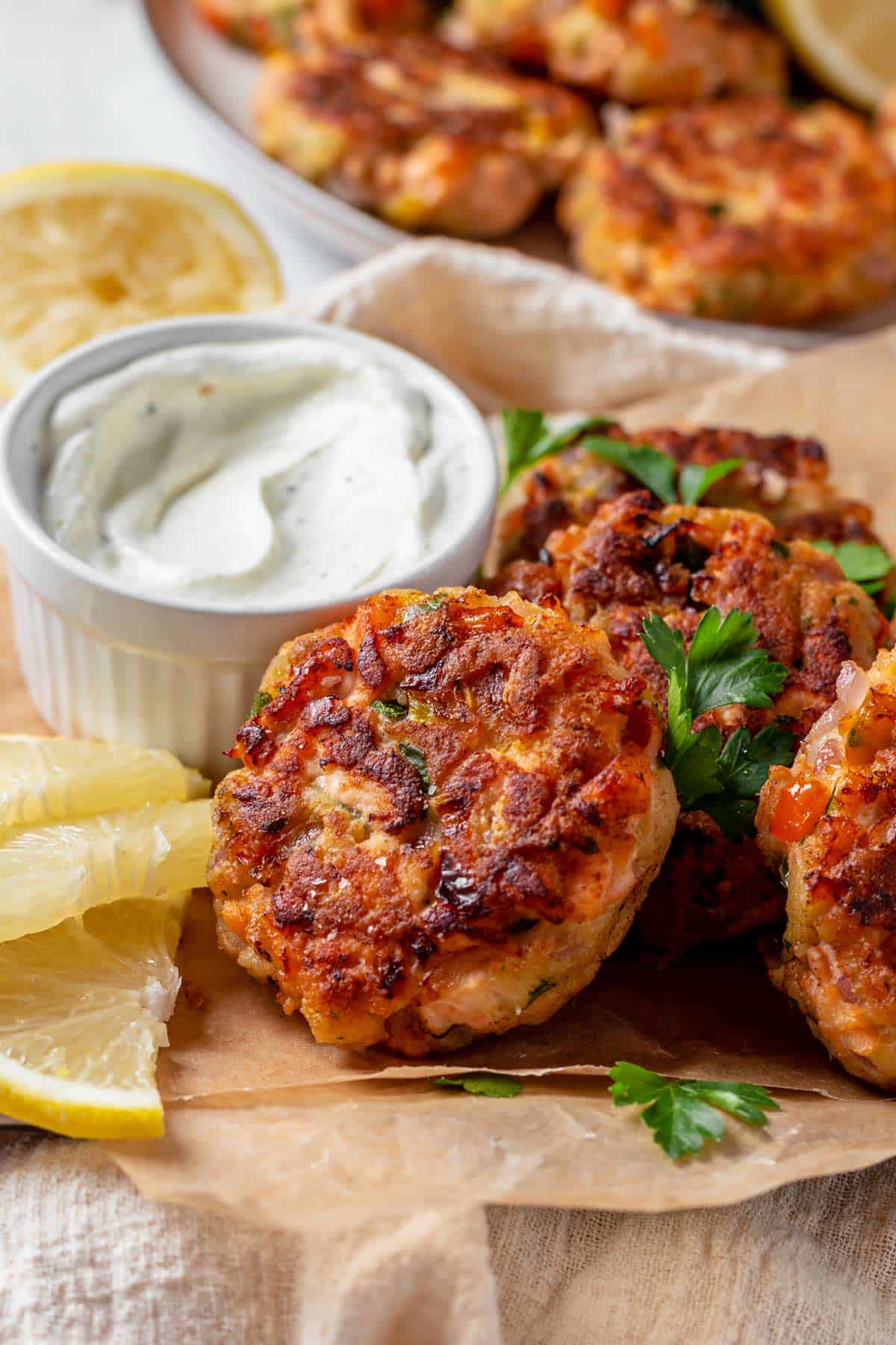 Fried Salmon Patties on a serving plate with parsley