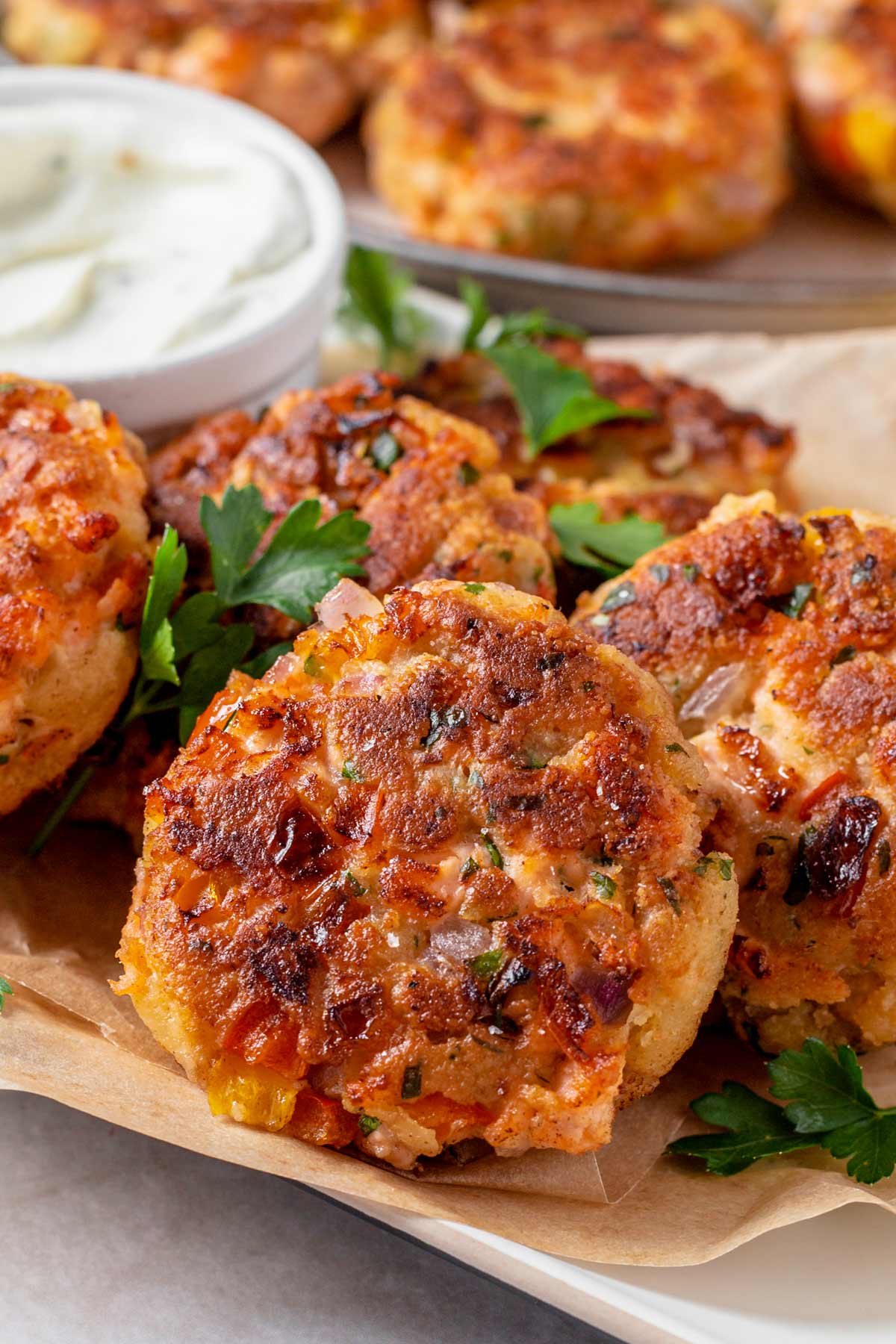 Fried Salmon Patties on a serving plate with parsley