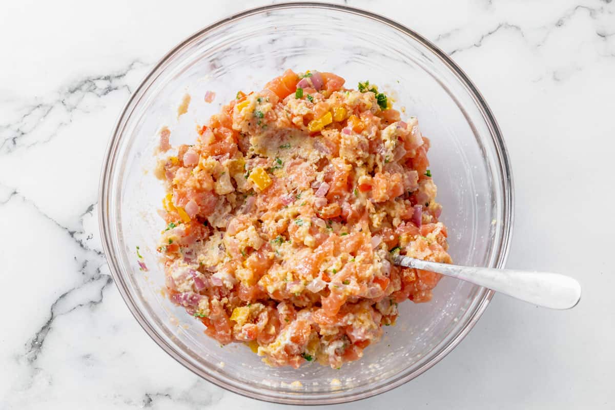 ingredients for salmon patties in a bowl after mixing together