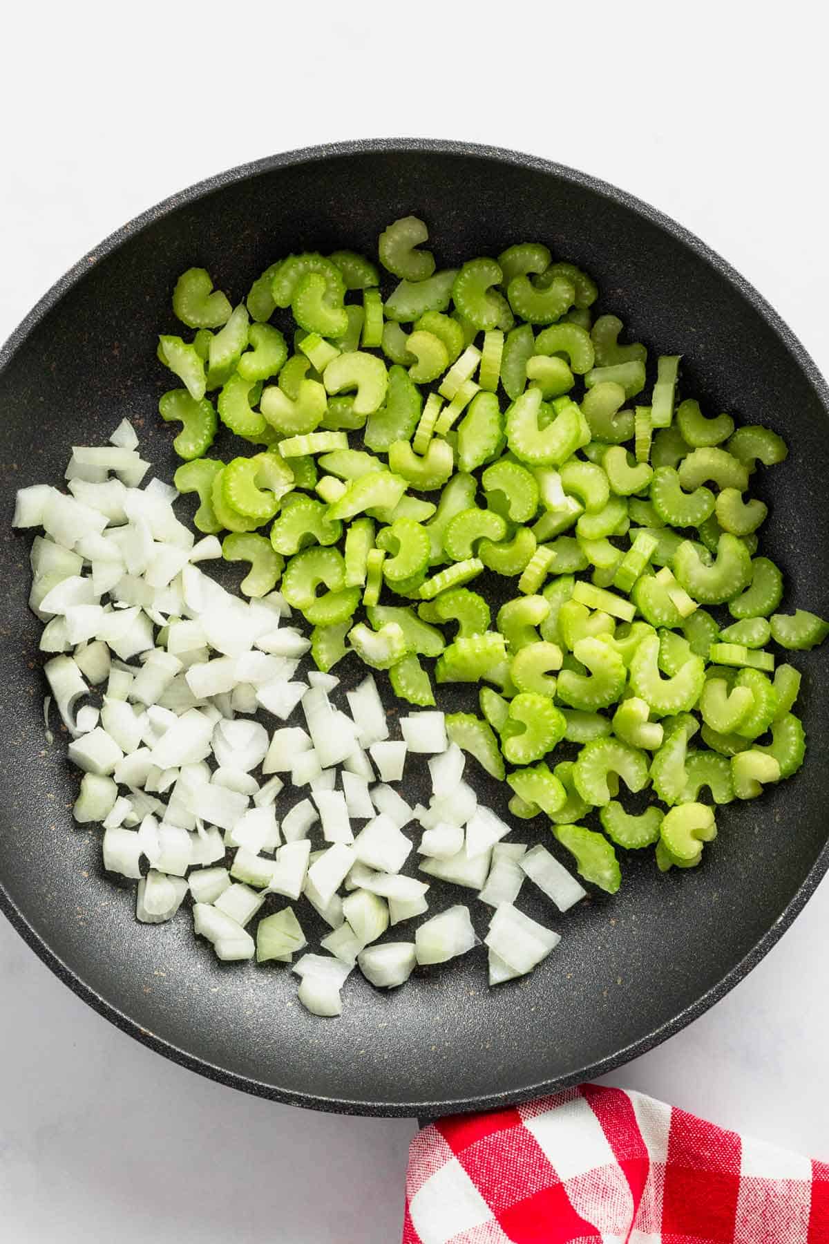sauteing celery and onions in skillet.