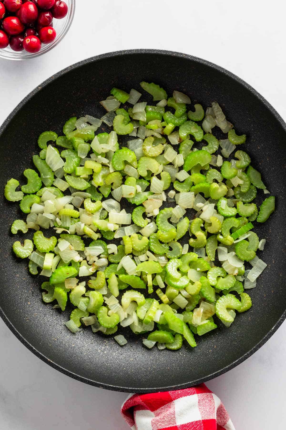 sauteing celery in skillet.