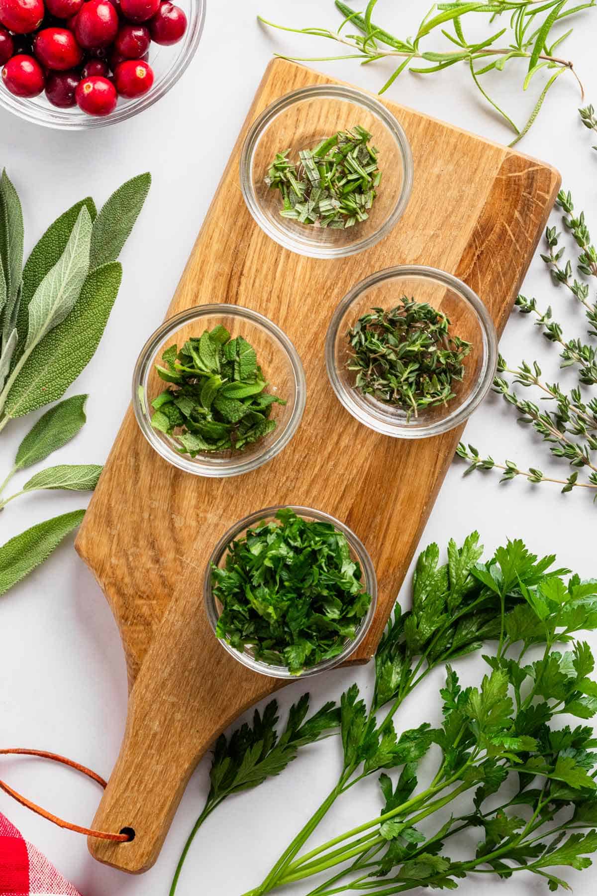 different herbs in bowls.