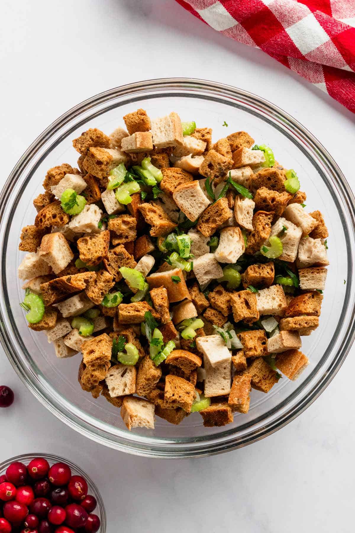 toasted bread, veggies and herbs in a bowl for stuffing.