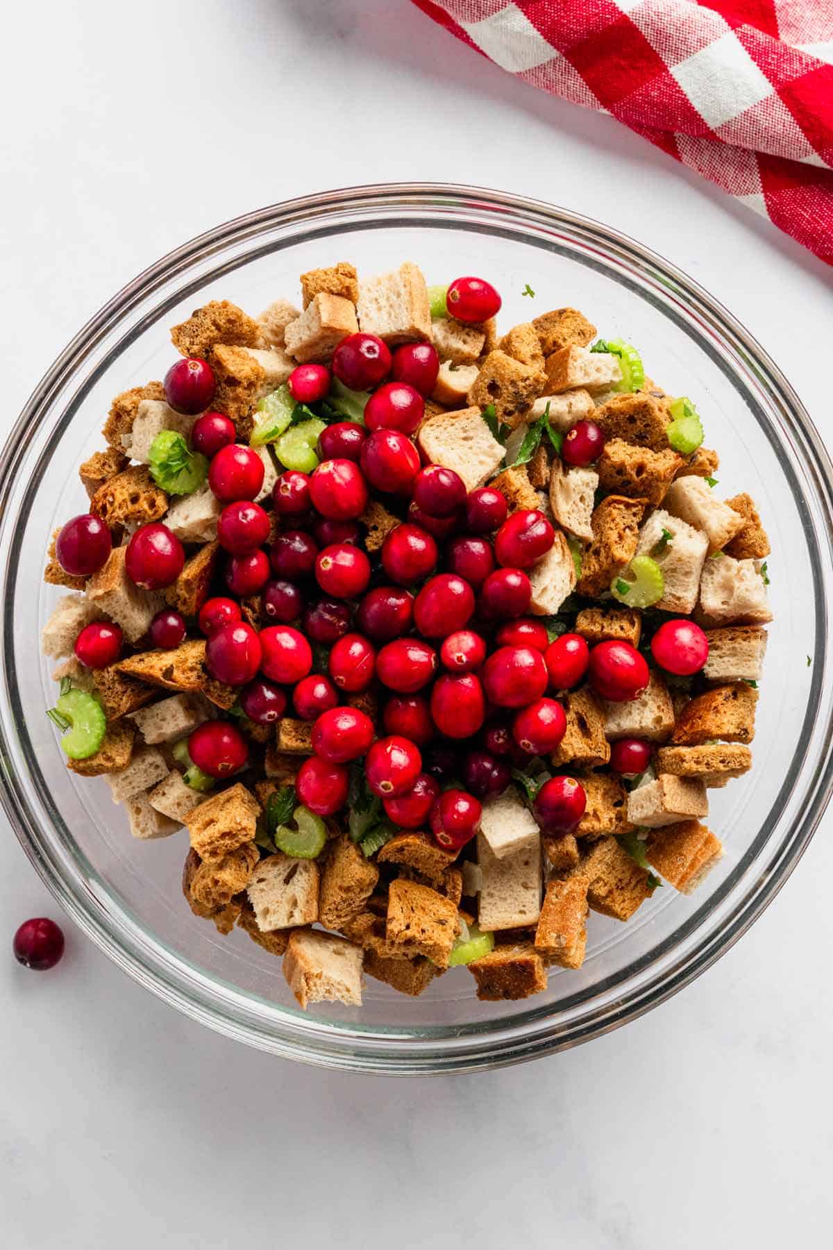 toasted bread, veggies and herbs in a bowl for stuffing.