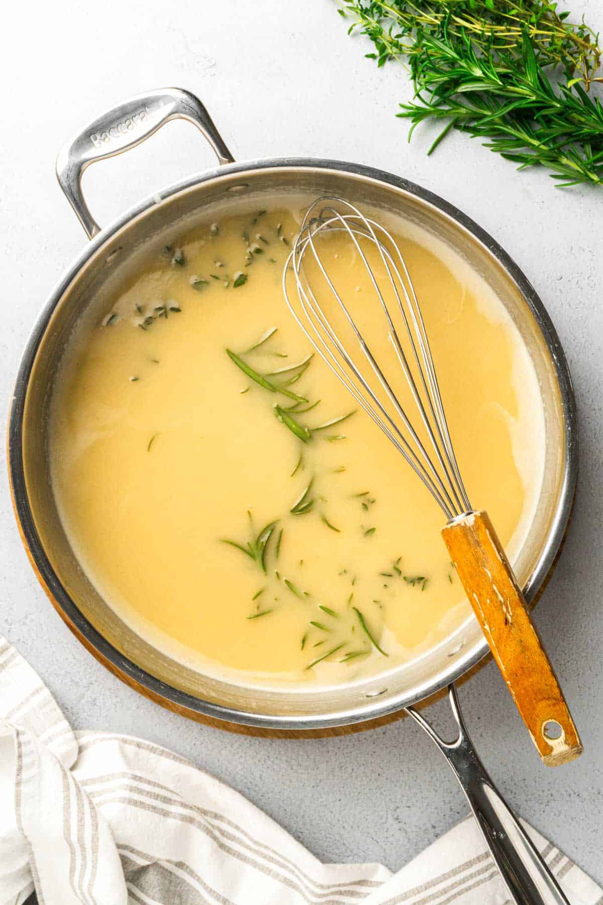 cooking the gravy in a saucepan.