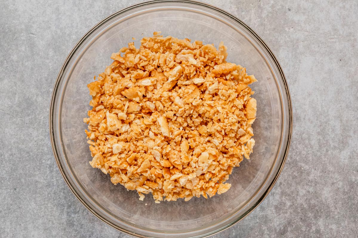 ritz crackers mixed with butter in bowl