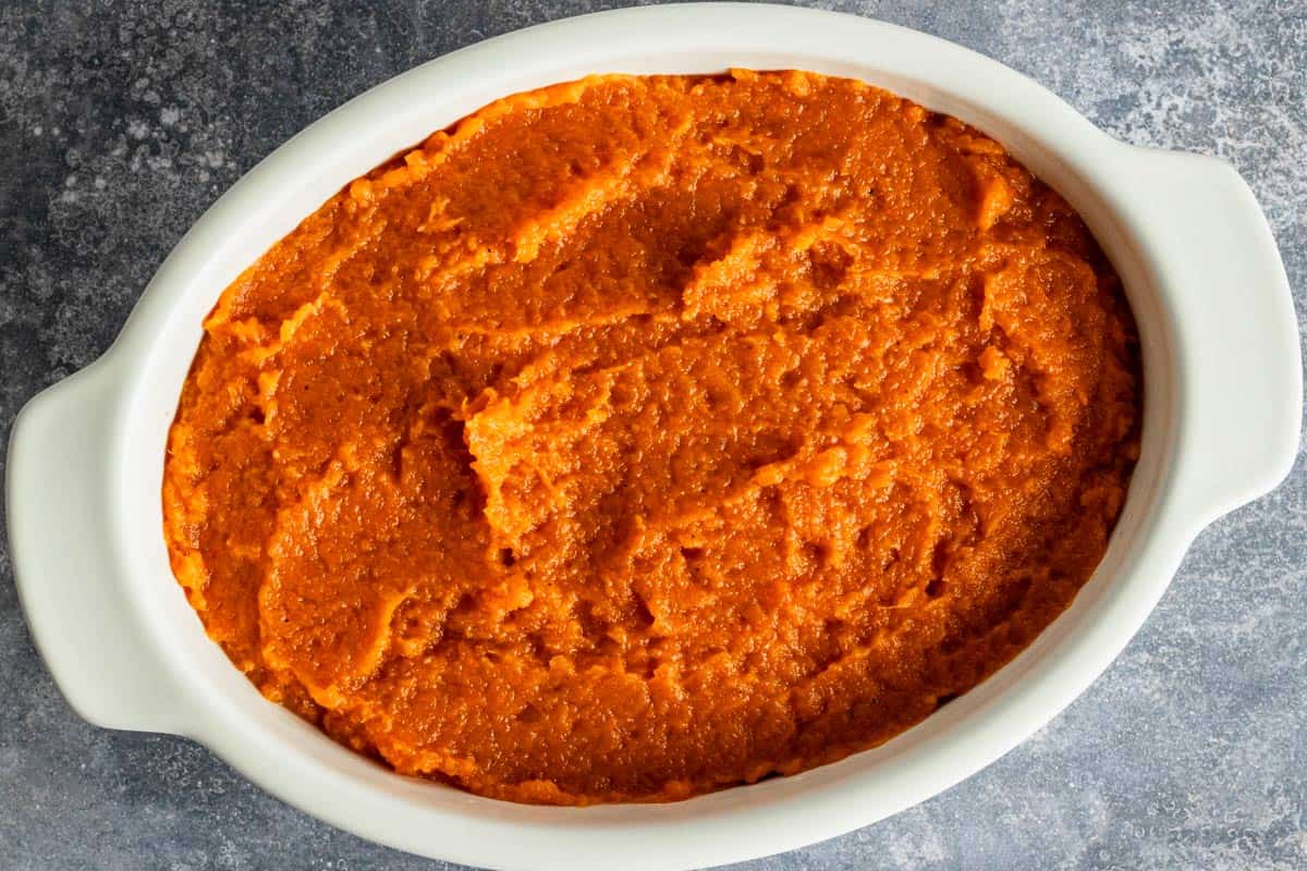 whipped sweet potatoes in casserole dish.
