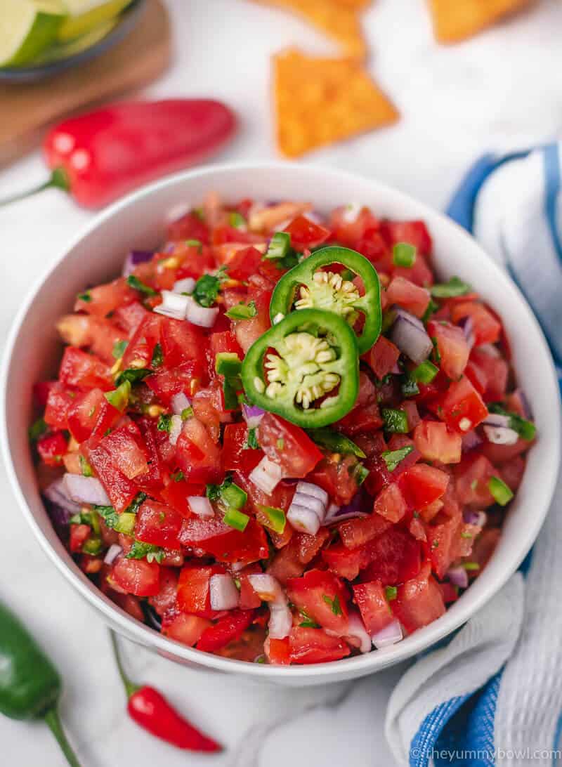 pico de gallo (mexican tomato salsa) in a bowl with tortilla chips