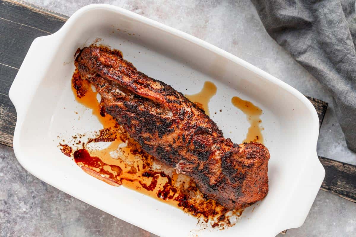 freshly baked pork tenderloin in casserole dish.