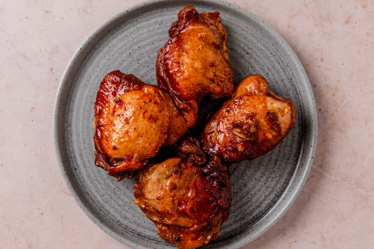 honey garlic chicken thighs on a plate after cooking