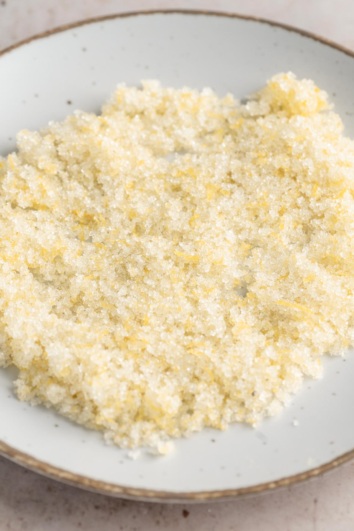 sugar and lemon zest in a bowl for coating