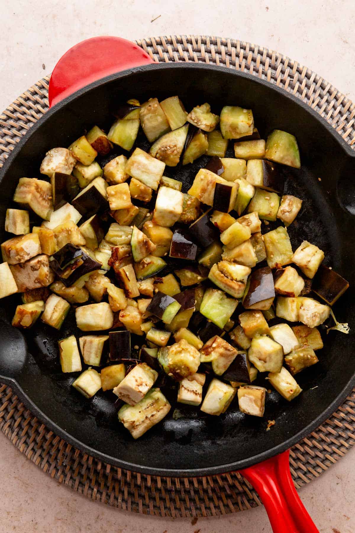 sauteing eggplant cubes in skillet.