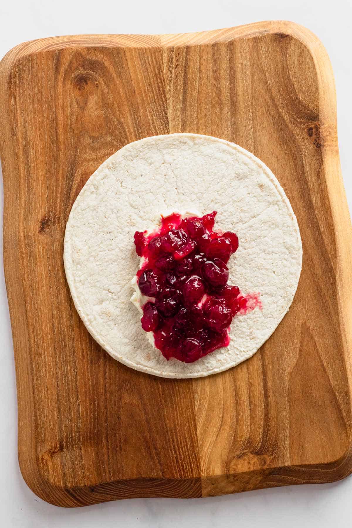 cream cheese topped with cranberry sauce.