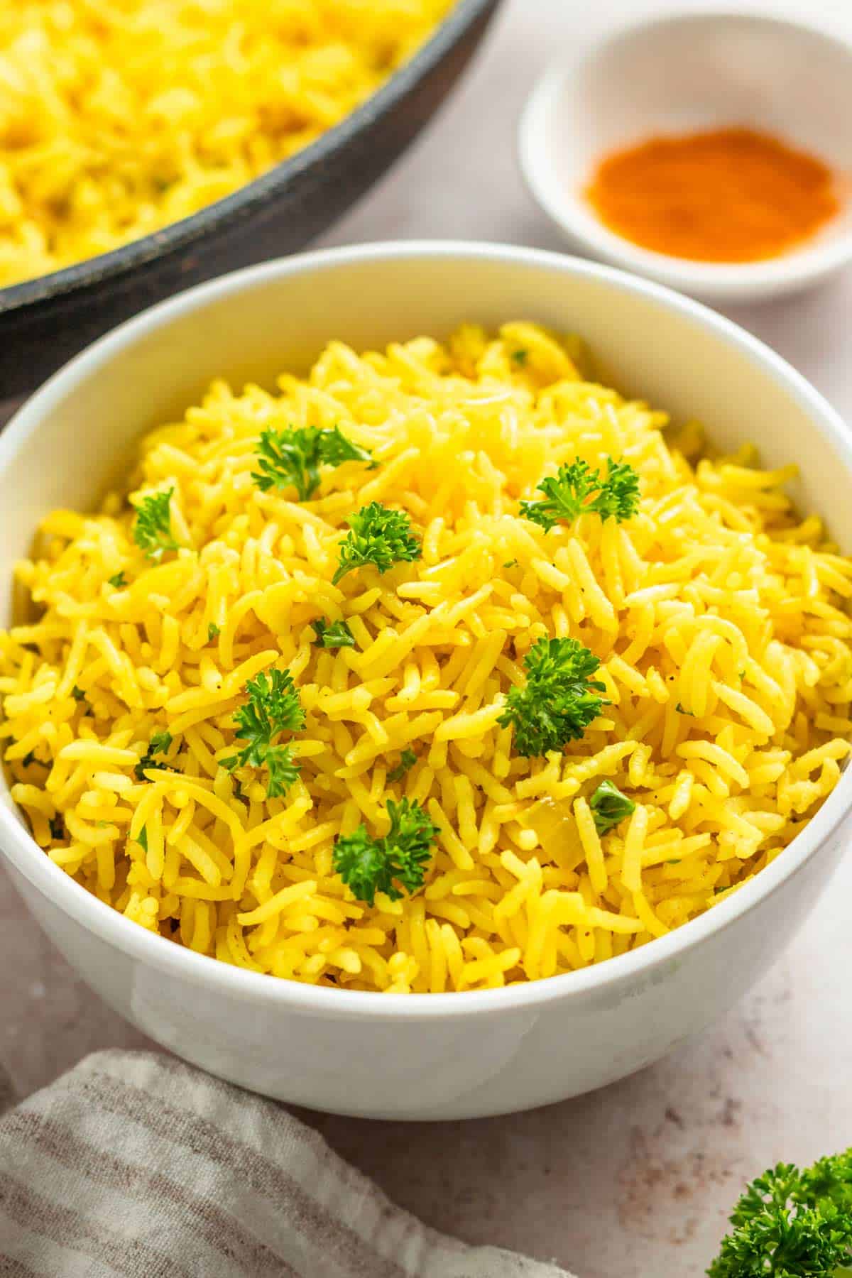 a bowl of yellow garlic turmeric rice.