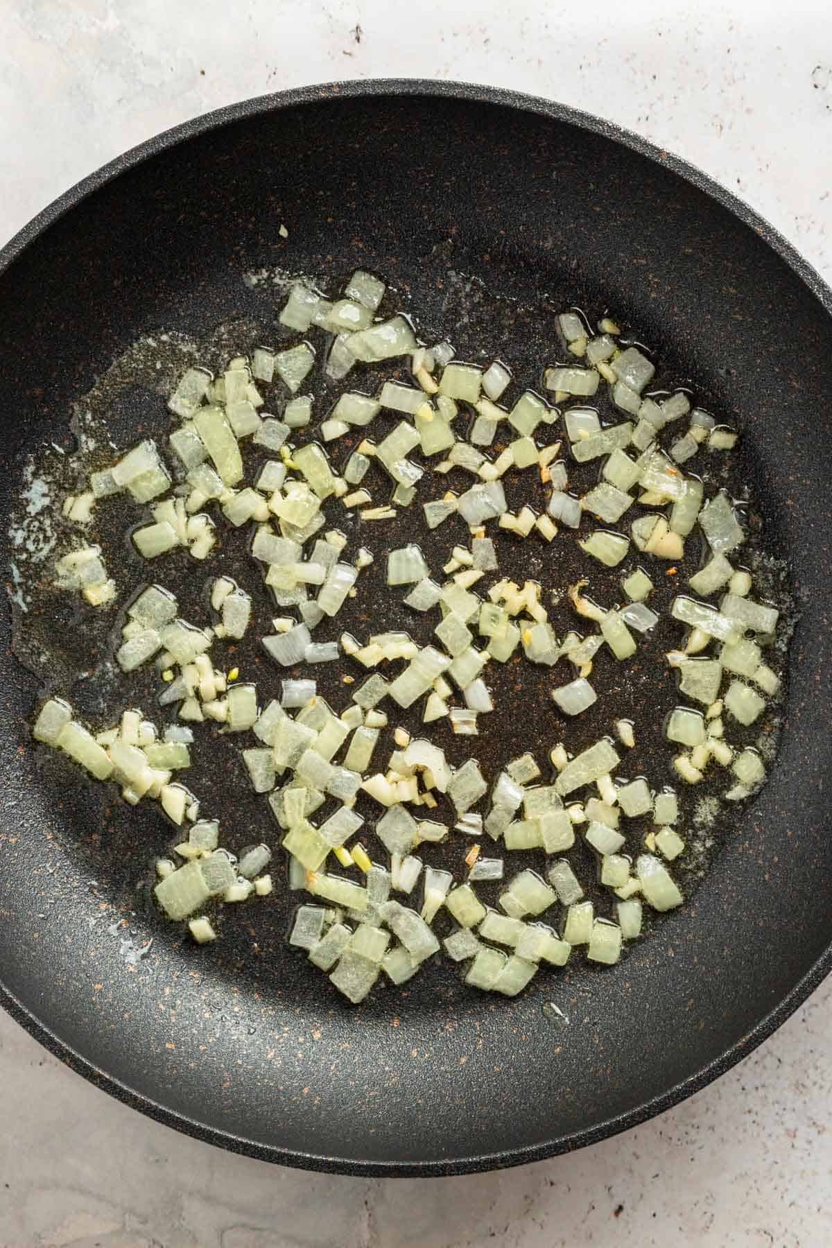 sauteing onion in skillet.