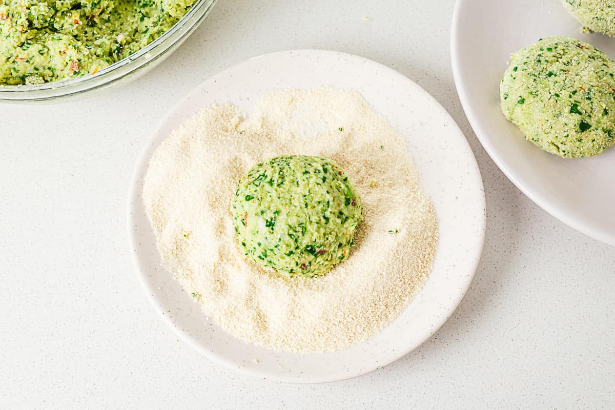 vegetarian green patty dipped into breadcrumbs